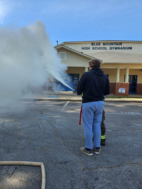 The students and teacher tried on firefighter outfits and hats, learned how to use a fire extinguisher, and practiced spraying the fire hoses. Thank you to Career Coach Deana Reno for helping to coordinate this presentation. 